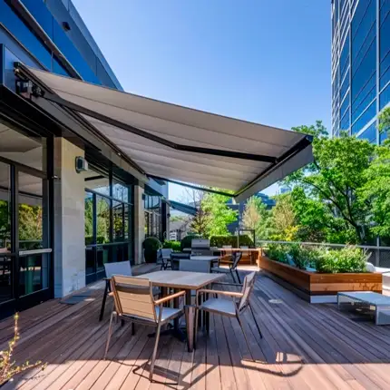 Commercial Retractable Awning installed over an outdoor restaurant or cafe area